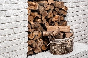 Log holder tray full of logs. Fireside storage.